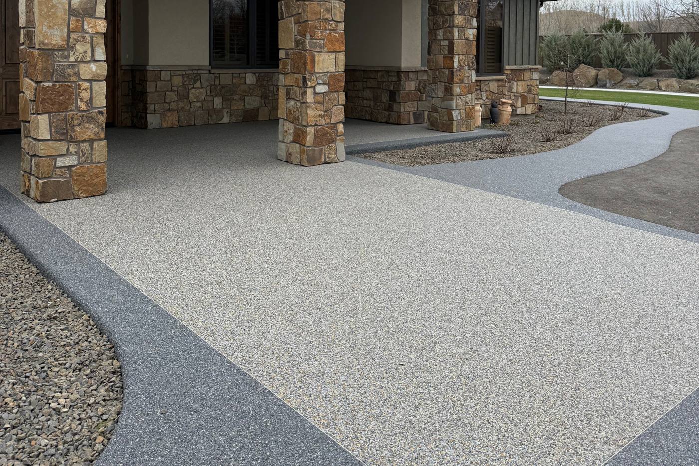 Resin bound driveway and entry in a pale stone blend with a darker border